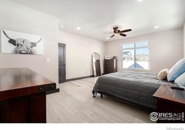 bedroom featuring ceiling fan and light hardwood / wood-style floors