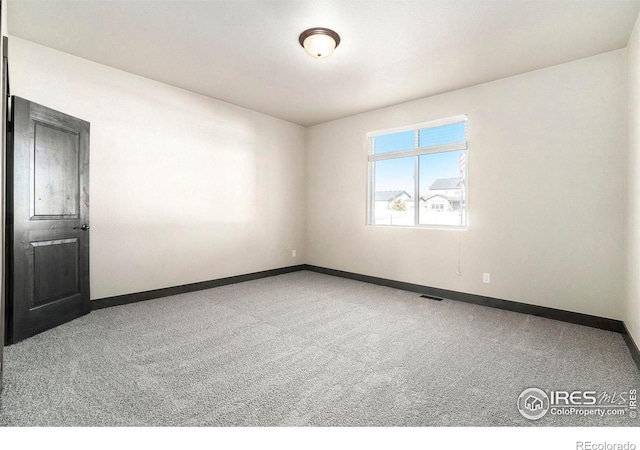 spare room with carpet flooring