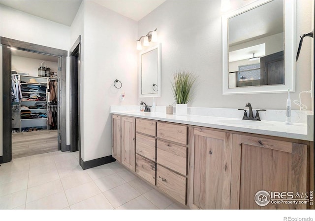 bathroom featuring vanity and tile patterned flooring