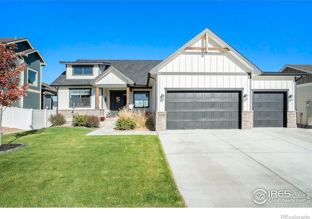 view of front of home featuring a garage and a front lawn