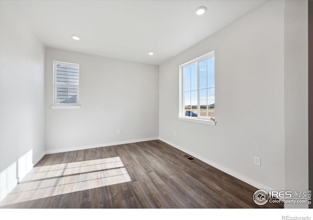 spare room featuring hardwood / wood-style flooring