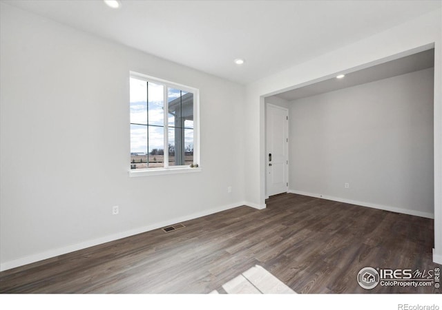 empty room featuring dark hardwood / wood-style floors