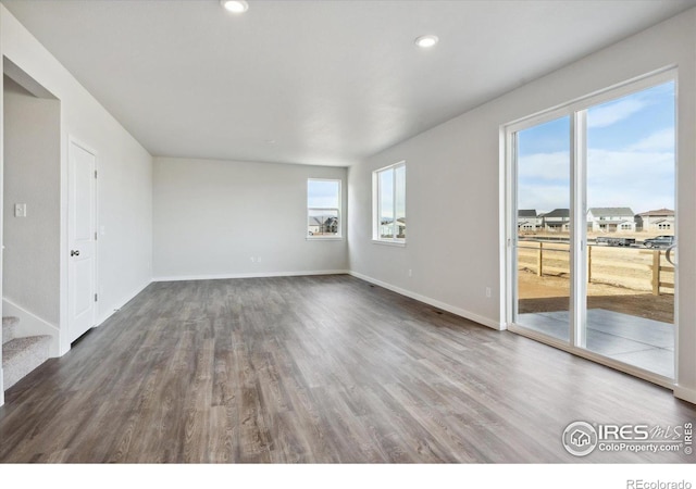 empty room featuring dark wood-type flooring