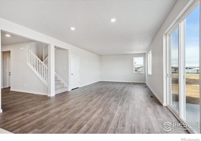 unfurnished living room with hardwood / wood-style floors