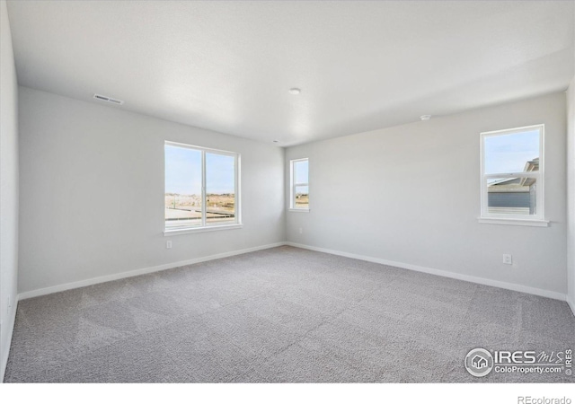 view of carpeted spare room