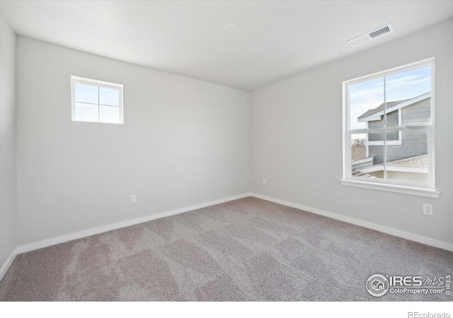 unfurnished room featuring carpet flooring