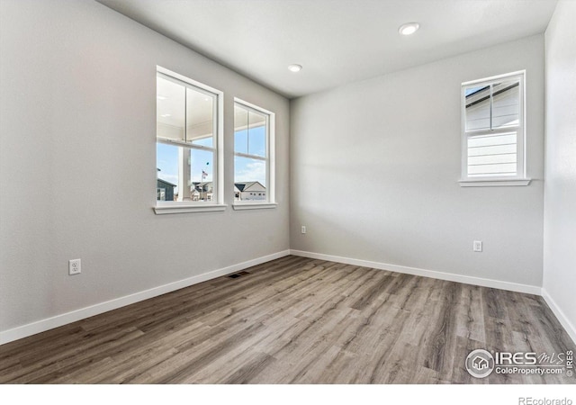 spare room featuring light wood-type flooring