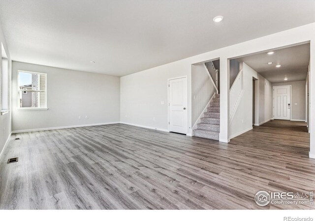 unfurnished room with light wood-type flooring