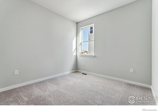 empty room featuring carpet floors