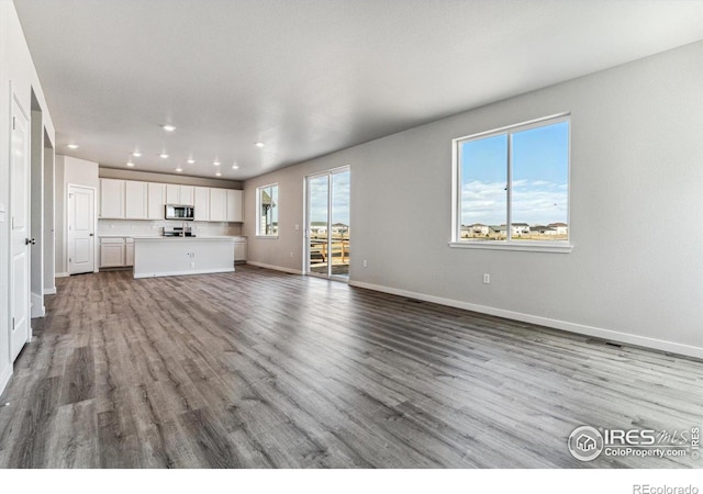 unfurnished living room featuring light hardwood / wood-style flooring