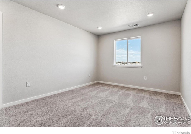 view of carpeted spare room