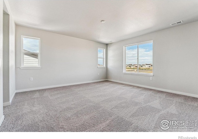 empty room featuring carpet flooring