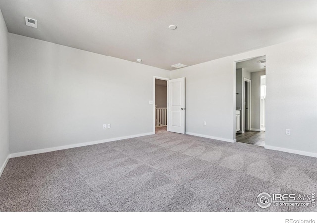 unfurnished room featuring carpet flooring