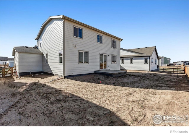 back of house with a wooden deck