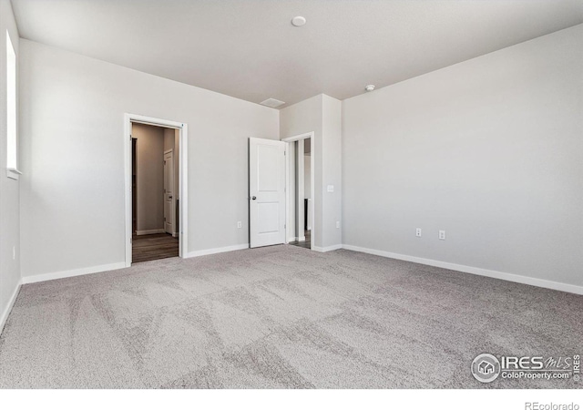 unfurnished bedroom with carpet flooring