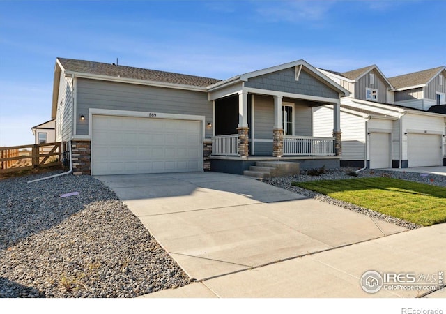 view of front of home with a garage and a porch