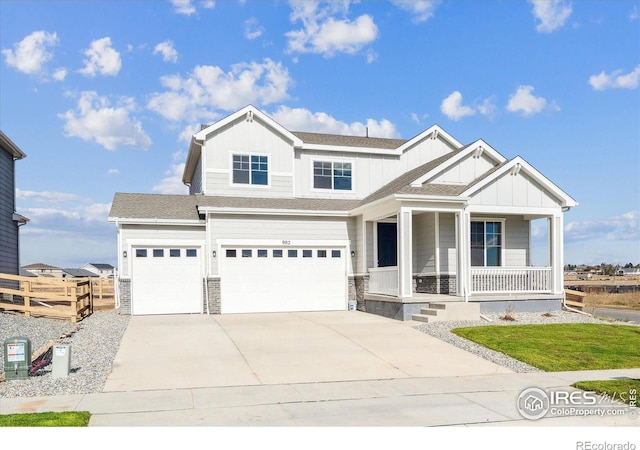 view of front of house featuring a porch and a garage