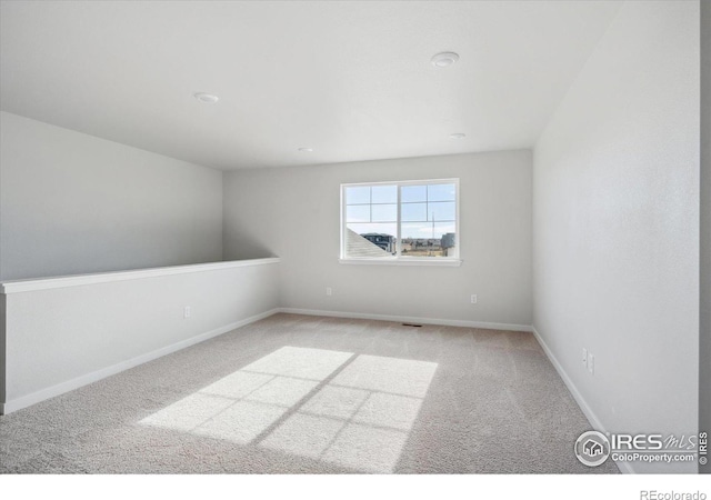 view of carpeted spare room