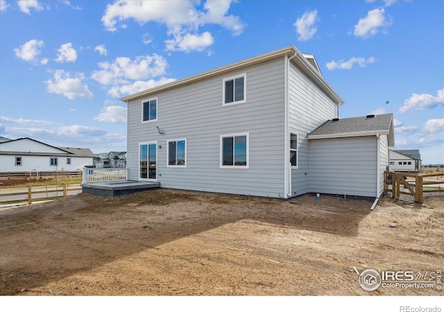 back of property featuring a deck