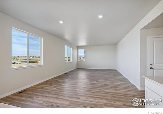 spare room featuring light hardwood / wood-style floors