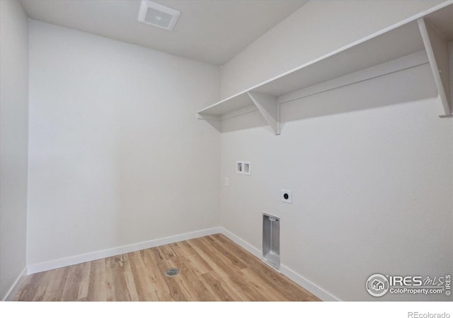 laundry room featuring electric dryer hookup, washer hookup, and light wood-type flooring