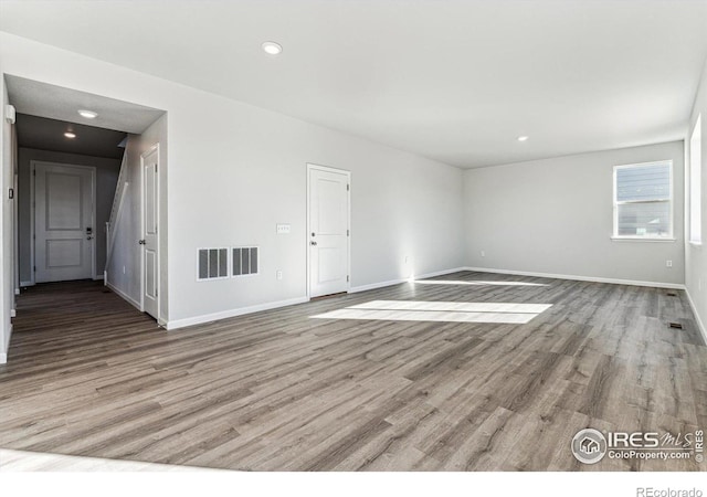 spare room with light hardwood / wood-style floors