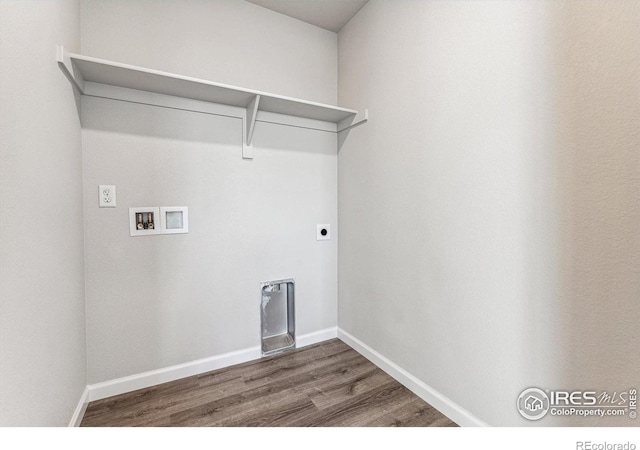 laundry room featuring laundry area, washer hookup, baseboards, wood finished floors, and hookup for an electric dryer