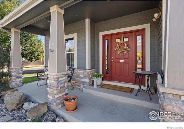 property entrance featuring covered porch