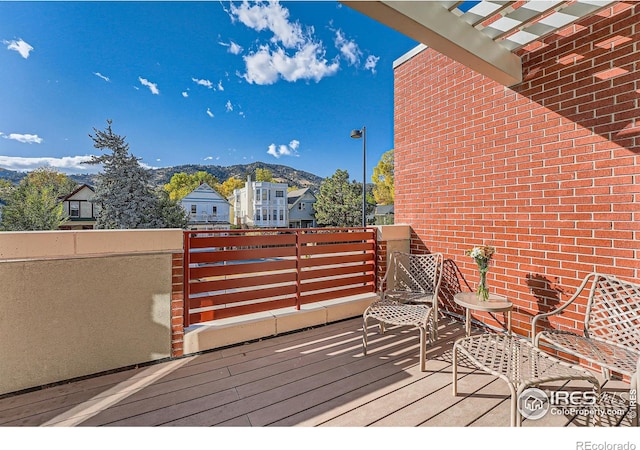 wooden deck featuring a mountain view