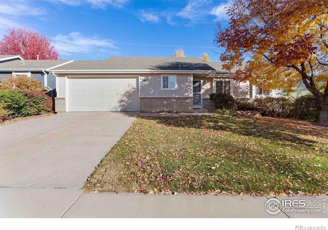 ranch-style house with a garage and a front lawn