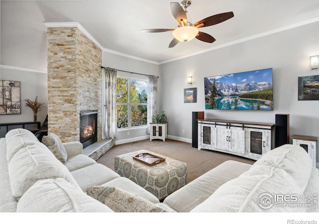 carpeted living room featuring ceiling fan, crown molding, and a stone fireplace