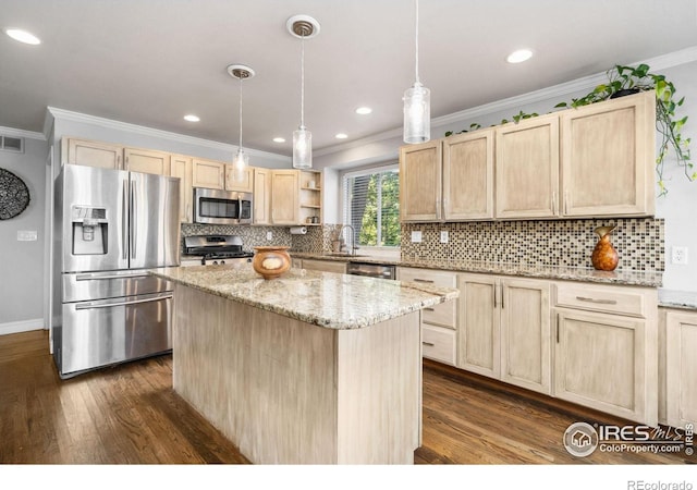 kitchen featuring appliances with stainless steel finishes, a center island, hanging light fixtures, dark wood-type flooring, and light brown cabinets