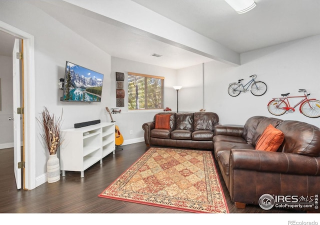 living room with beam ceiling and dark hardwood / wood-style floors