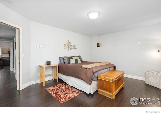 bedroom featuring dark hardwood / wood-style floors