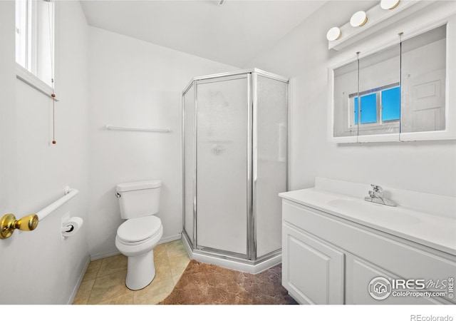 bathroom with a shower with door, vanity, toilet, and tile patterned flooring