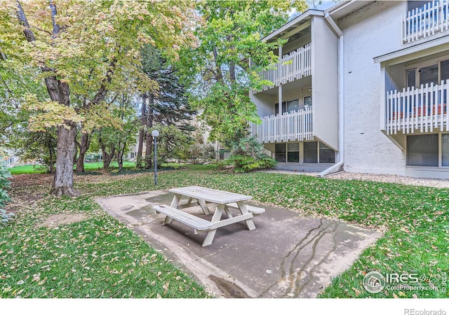 surrounding community featuring a patio area and a yard