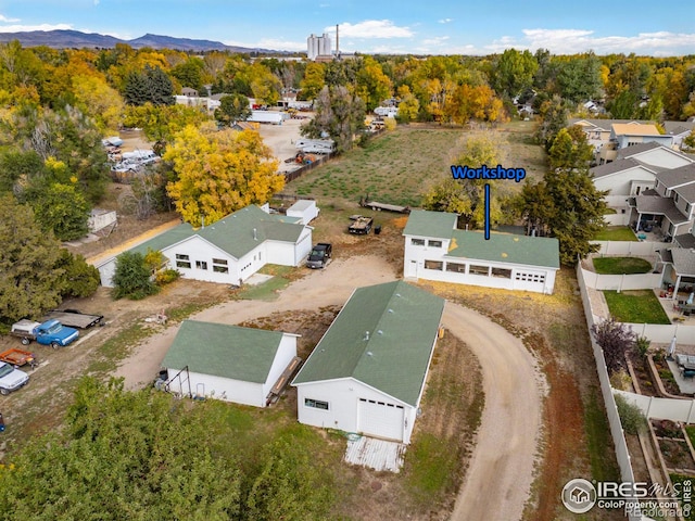 birds eye view of property featuring a mountain view