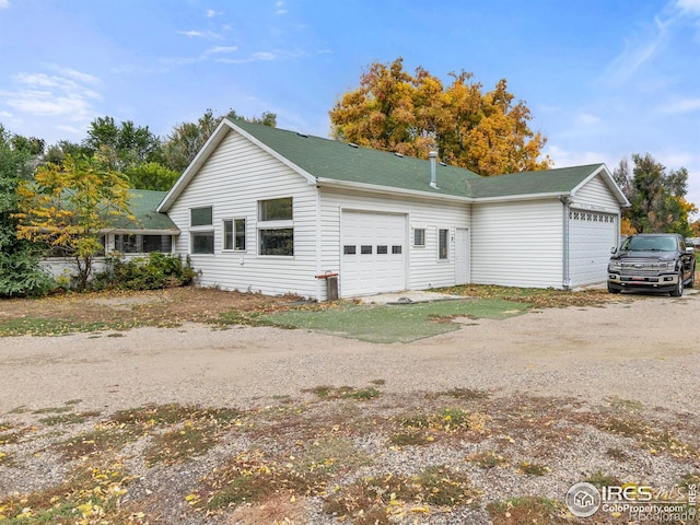 view of property exterior with a garage