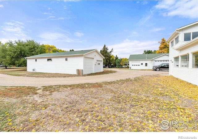 view of side of property featuring a garage