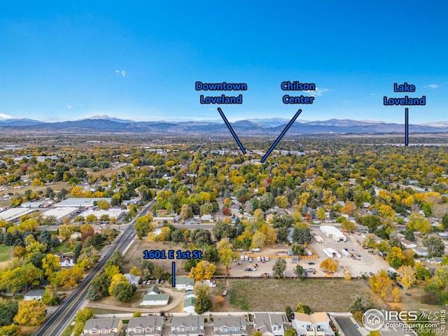 birds eye view of property with a mountain view