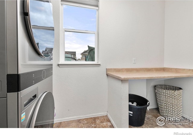 washroom with stacked washer / dryer