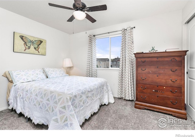 carpeted bedroom with a closet and ceiling fan