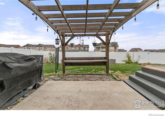 view of patio / terrace featuring area for grilling and a pergola