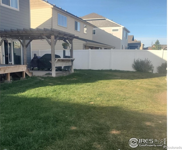 view of yard with a patio area and a pergola