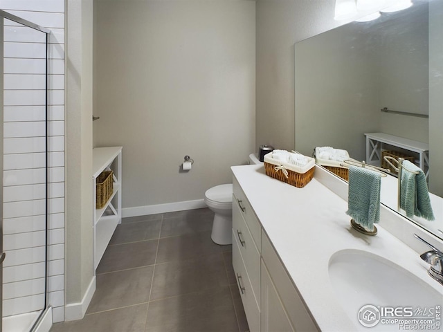 bathroom featuring a shower with door, toilet, tile patterned flooring, and vanity