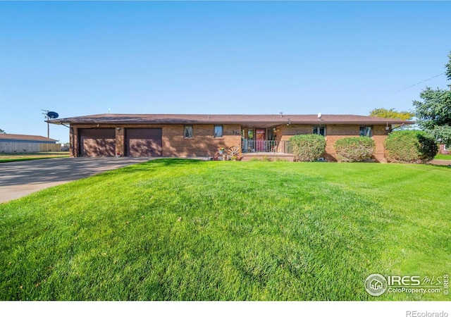 ranch-style house with a front lawn and a garage