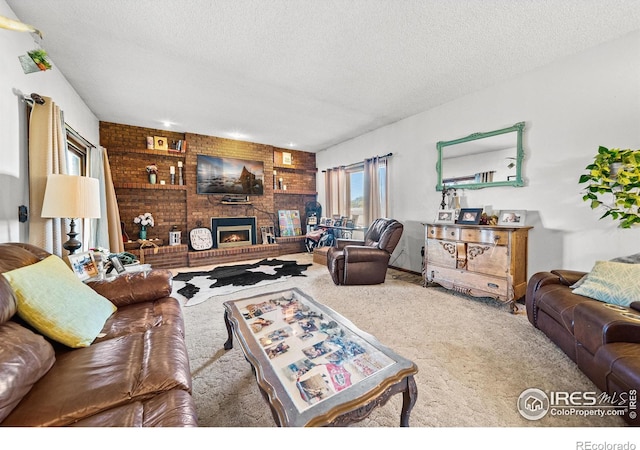 living room with a textured ceiling, a fireplace, and carpet flooring