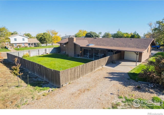 single story home featuring a front lawn and a carport