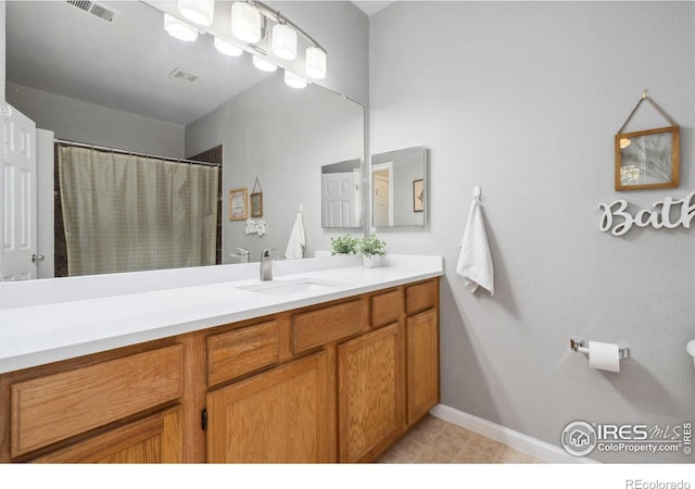 bathroom with vanity and tile patterned floors