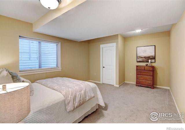 bedroom featuring light colored carpet